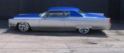 Picture of classic blue lowride car in blue and silver.jpg