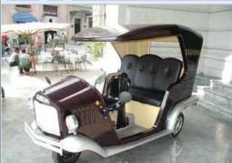 Image of a funky three wheeled car with a classic style.jpg