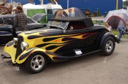 vintage of custom car in black with fire llines.jpg