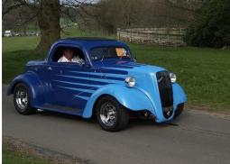 Blue Ford custom car with two door.jpg