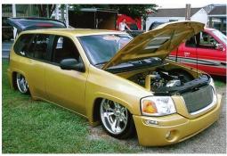 GMC Envoy car in dark gold color.jpg