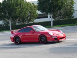 Porsche 997 GT3 with red exotic car.jpg