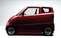 Beautiful dark red small car with two doors.JPG