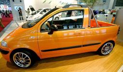 Smallest truck in yellow with black lines image.JPG