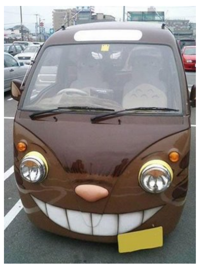 Classic van painted with evil smile face.PNG