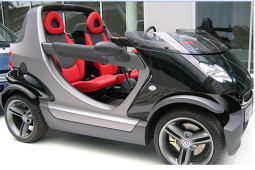 Very cool smart car in black with red car seats.PNG