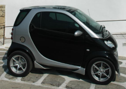 Picture of black smart car with silver patterns.PNG