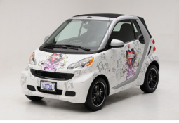 Ed Hardy smart car in white with very cool artistic painting.PNG