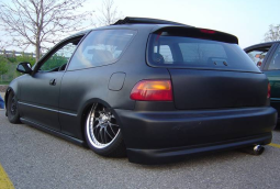 Black lower rider car with two doors.PNG