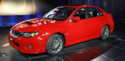 2011 Subaru Impreza WRX STI in bright red.PNG