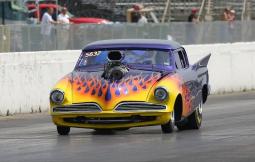 The St. Louis-based ‘53 Commander of Mike Hill_muscle car in purple with fire paint.jpg