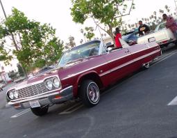 Chevrolet convertible low rider car in red.JPG