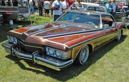 70's lowrider car in nice maroon orange paint job.JPG