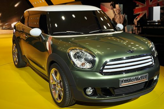 Green mini cooper with white top.PNG