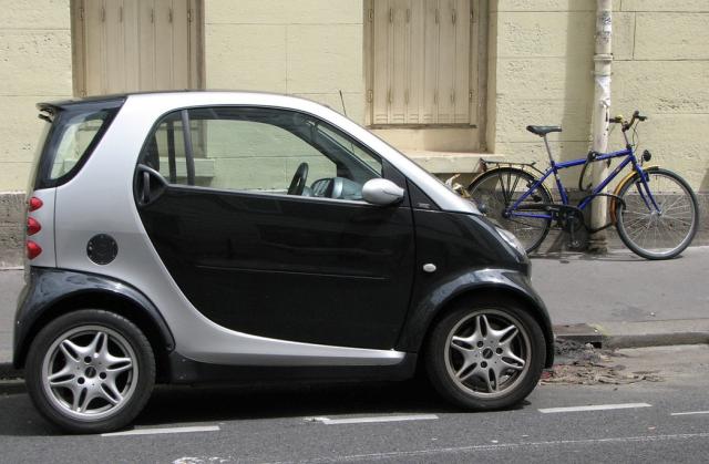 black and silver Smart car on the street photo.jpg