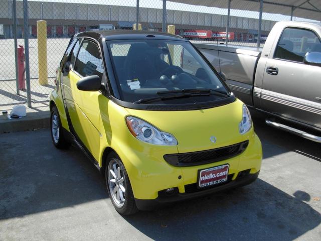 Bright yellow smart car photo.jpg