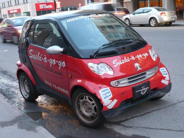picture of red Smart car on the street.jpg