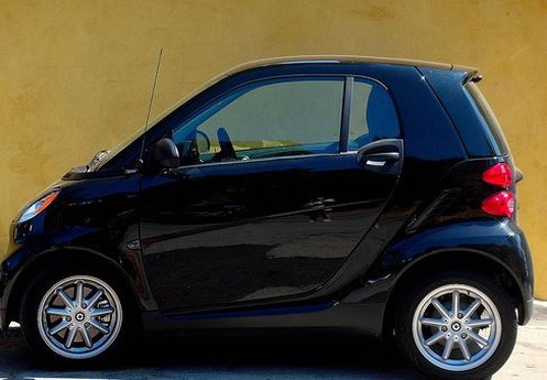 Navy blue Smart car photos on the street.jpg